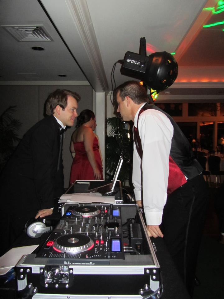 Family DJ taking song requests from guests at an event